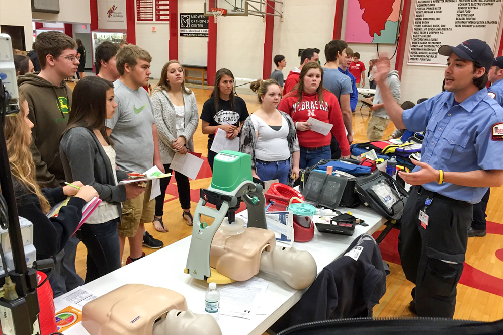 Showing cpr to grade school students