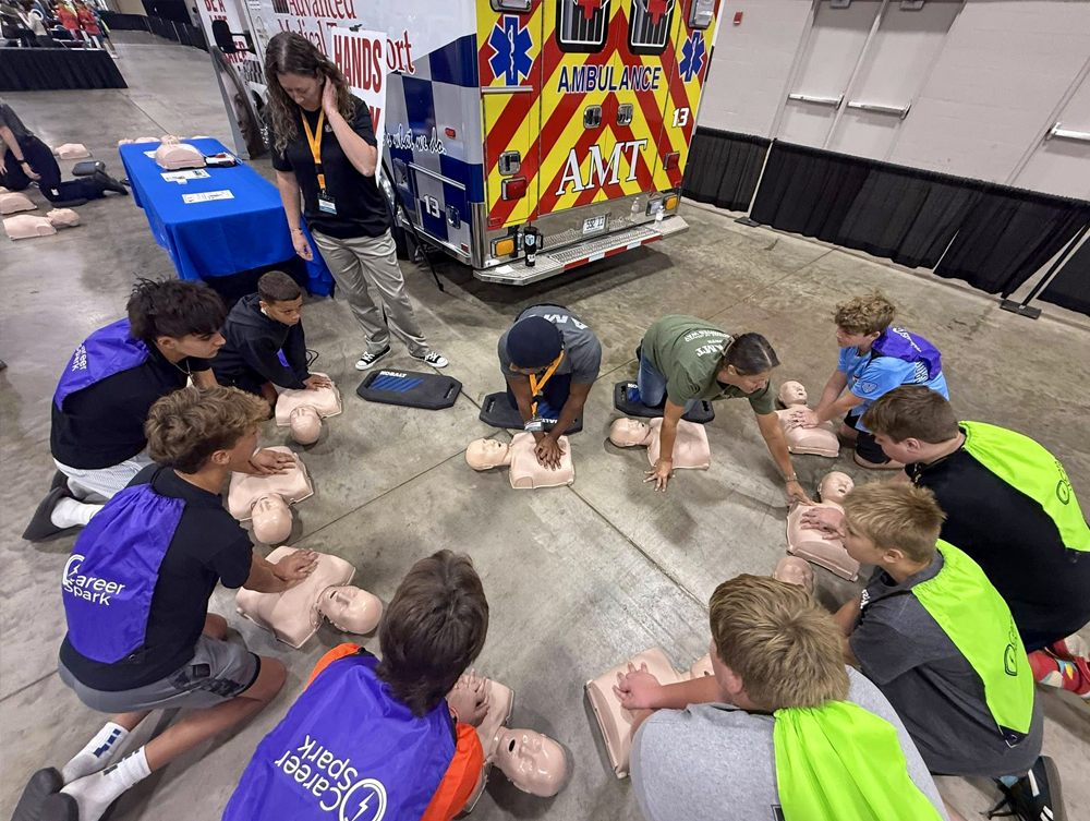 AMT employees talking to children at a school